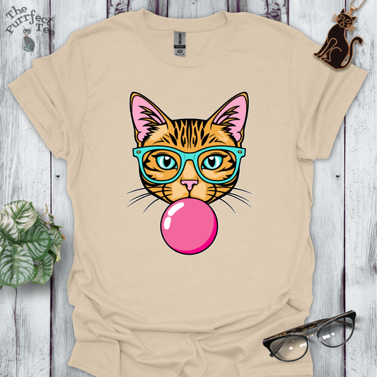 Ginger cat with turquoise glasses and bubble gum